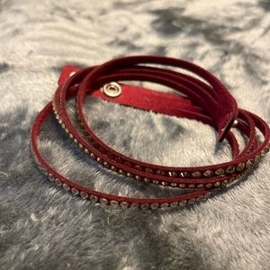 - Swarovski wrap bracelet.  Maroon in color